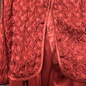 Cache quilted satin top with satin pants that are flare that slit up